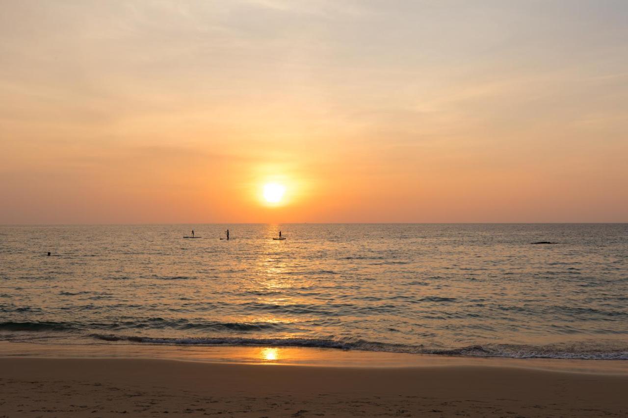 Outrigger Surin Beach Resort - Sha Extra Plus Kültér fotó Sunset at the beach