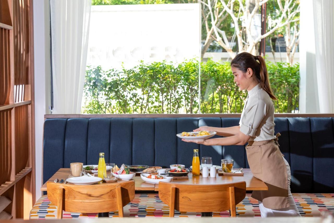 Outrigger Surin Beach Resort - Sha Extra Plus Kültér fotó A Thai waitress serving food