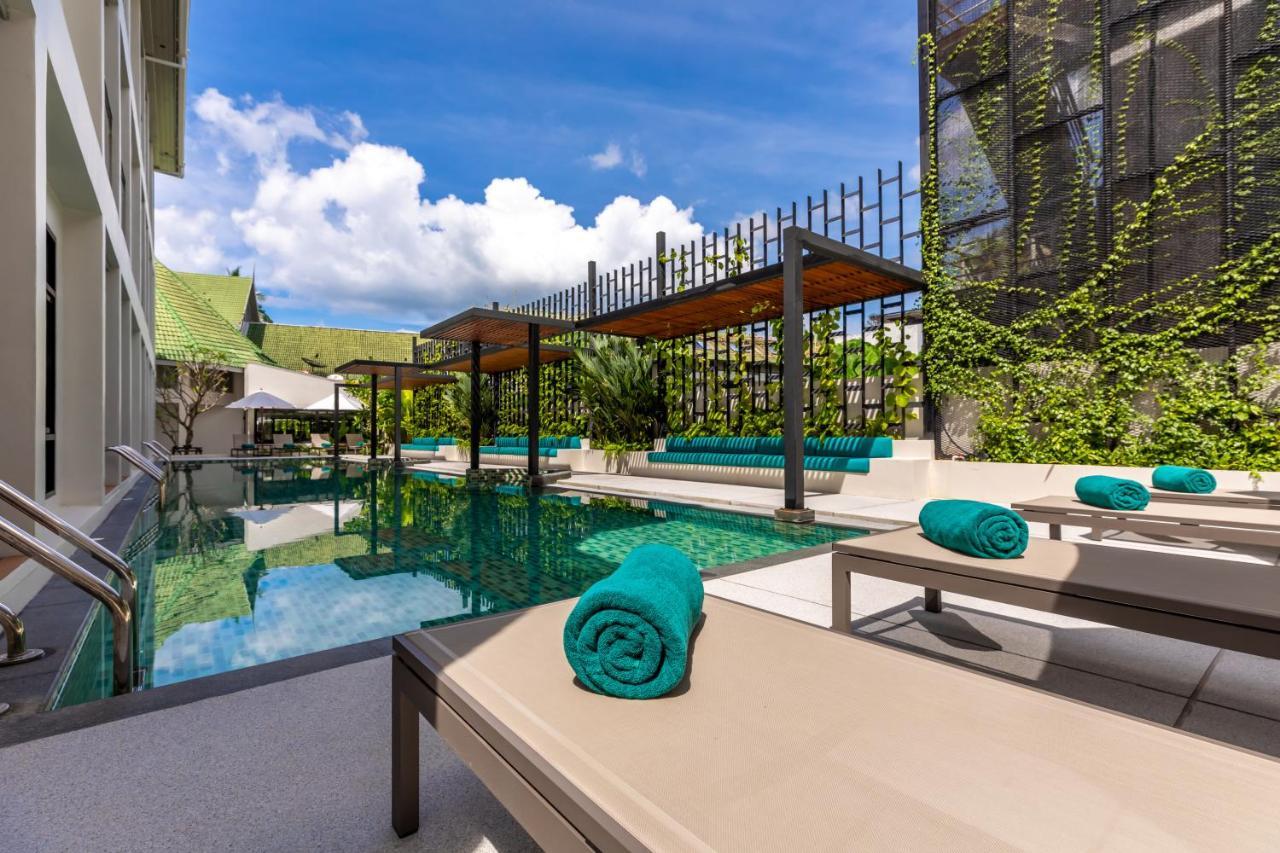 Outrigger Surin Beach Resort - Sha Extra Plus Kültér fotó The swimming pool at the hotel