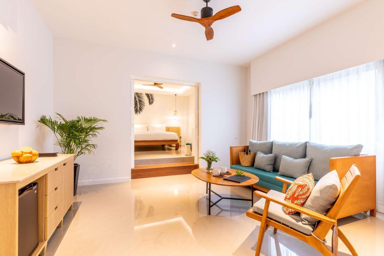 Outrigger Surin Beach Resort - Sha Extra Plus Kültér fotó A living room in a serviced apartment in Singapore